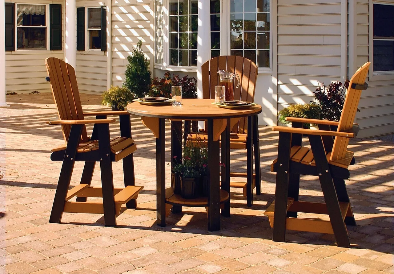 A patio set with table and chairs on brick floor.