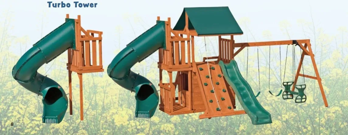 A wooden play structure with green slide and climbing wall.