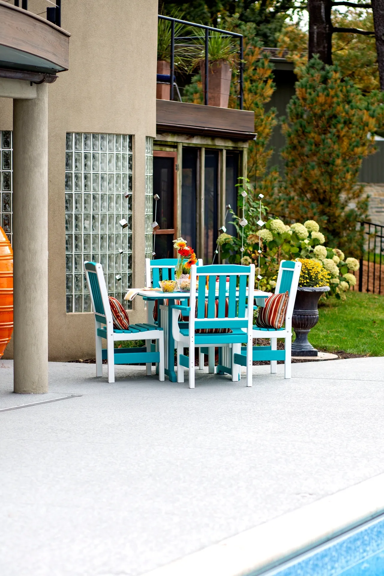 A table and chairs set up outside on the patio.