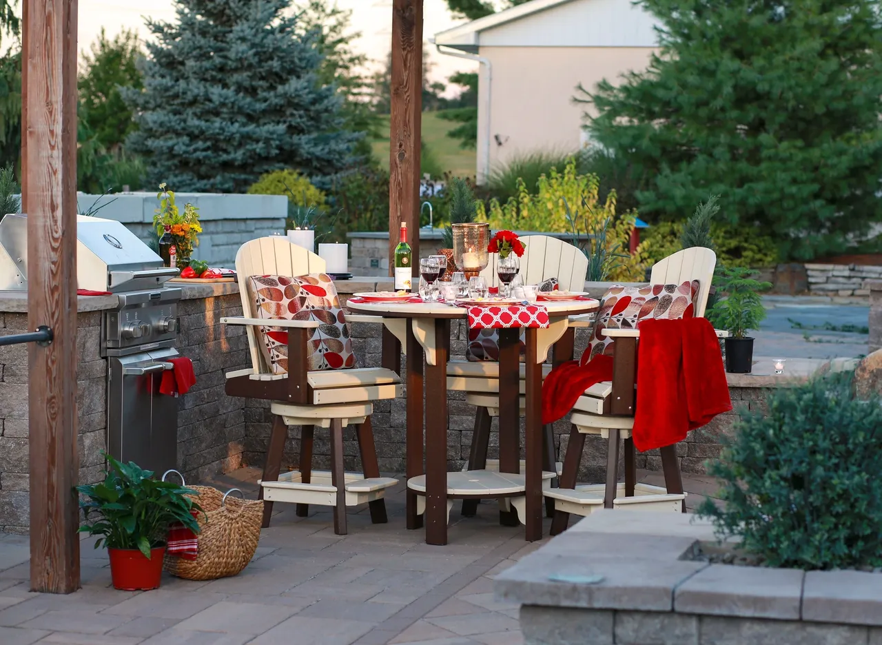 A table and chairs set up outside on the patio.