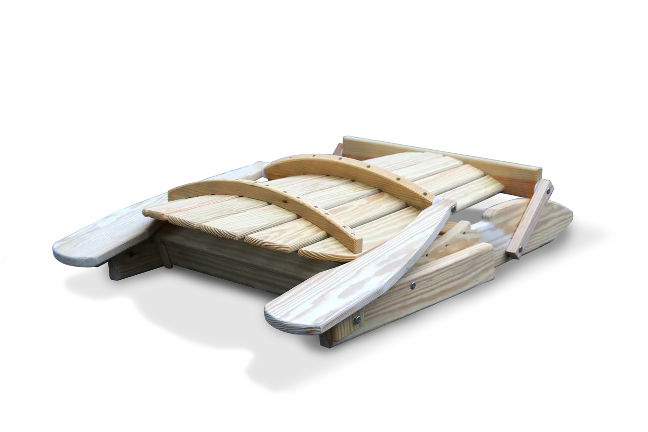 A wooden bridge with two white seats on it.