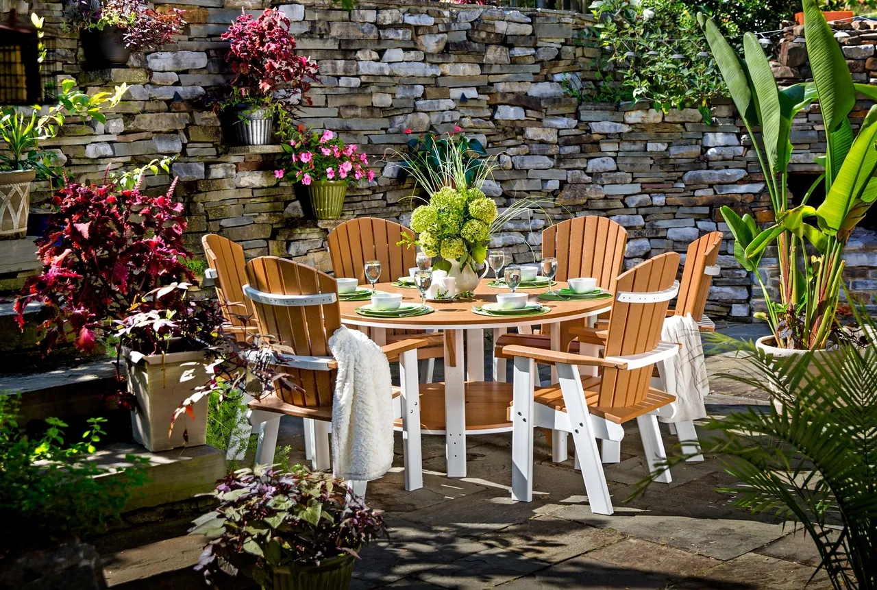 A table and chairs set up in the garden.