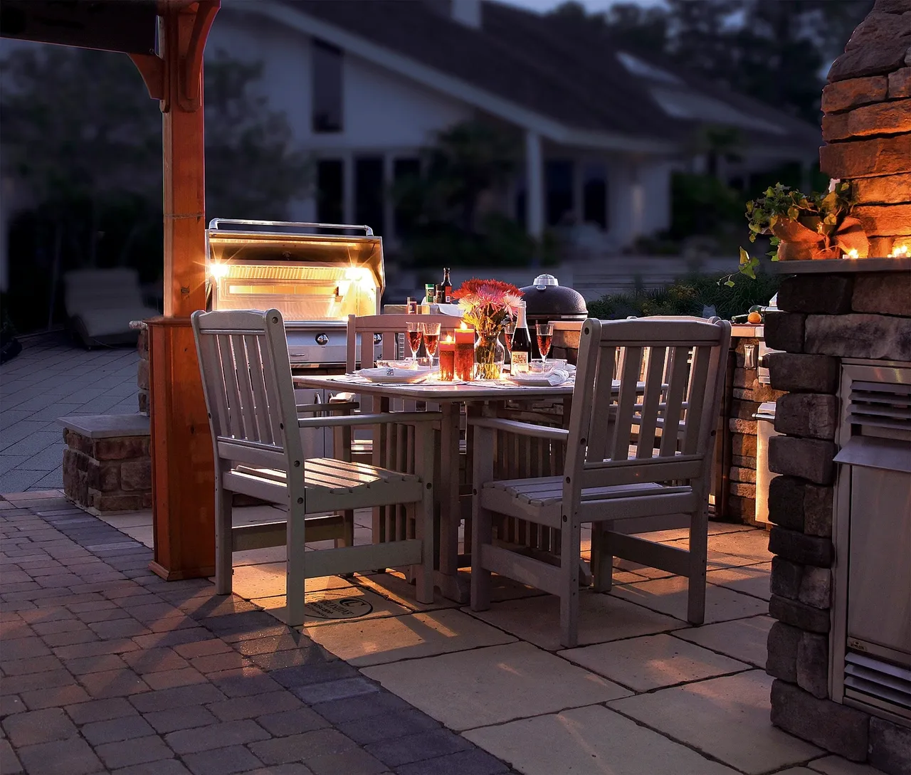 A table and chairs set up outside in the evening.