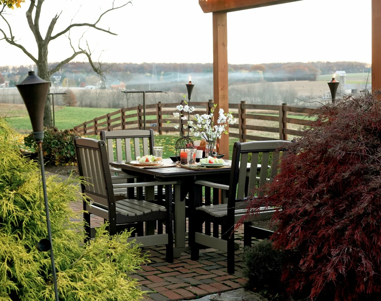 A table and chairs set up outside in the sun.
