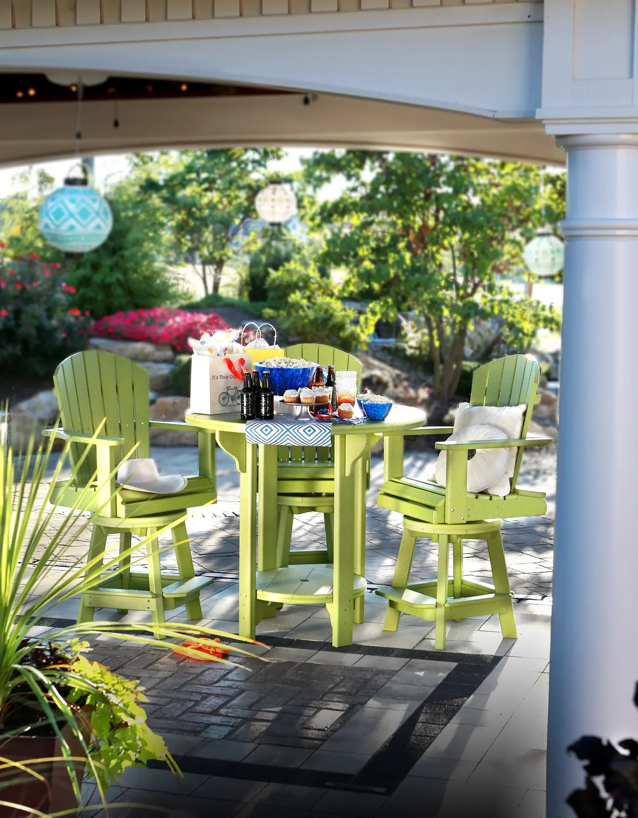 A table and chairs set up in the shade of a gazebo.