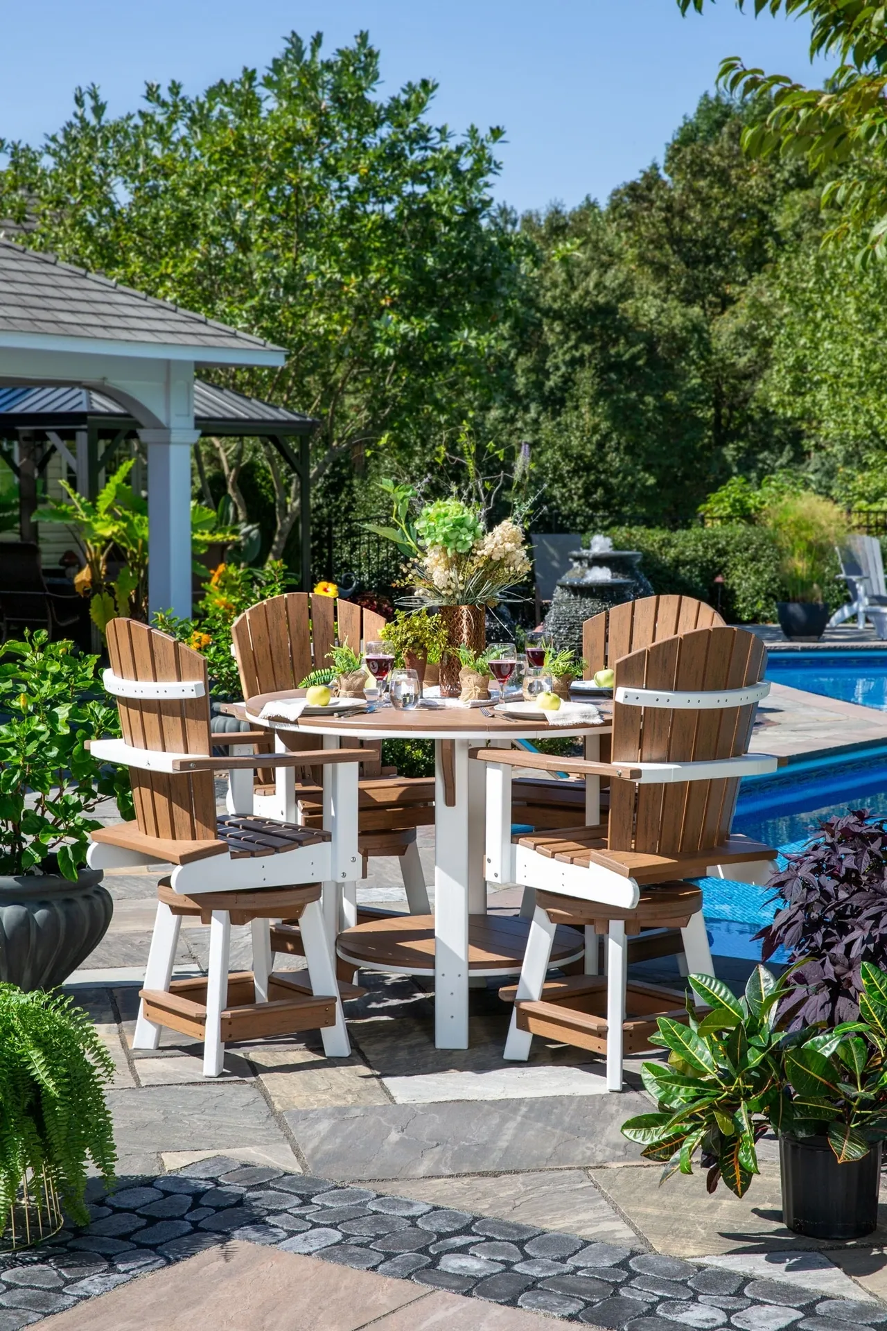 A table and chairs set in the middle of an outdoor patio.