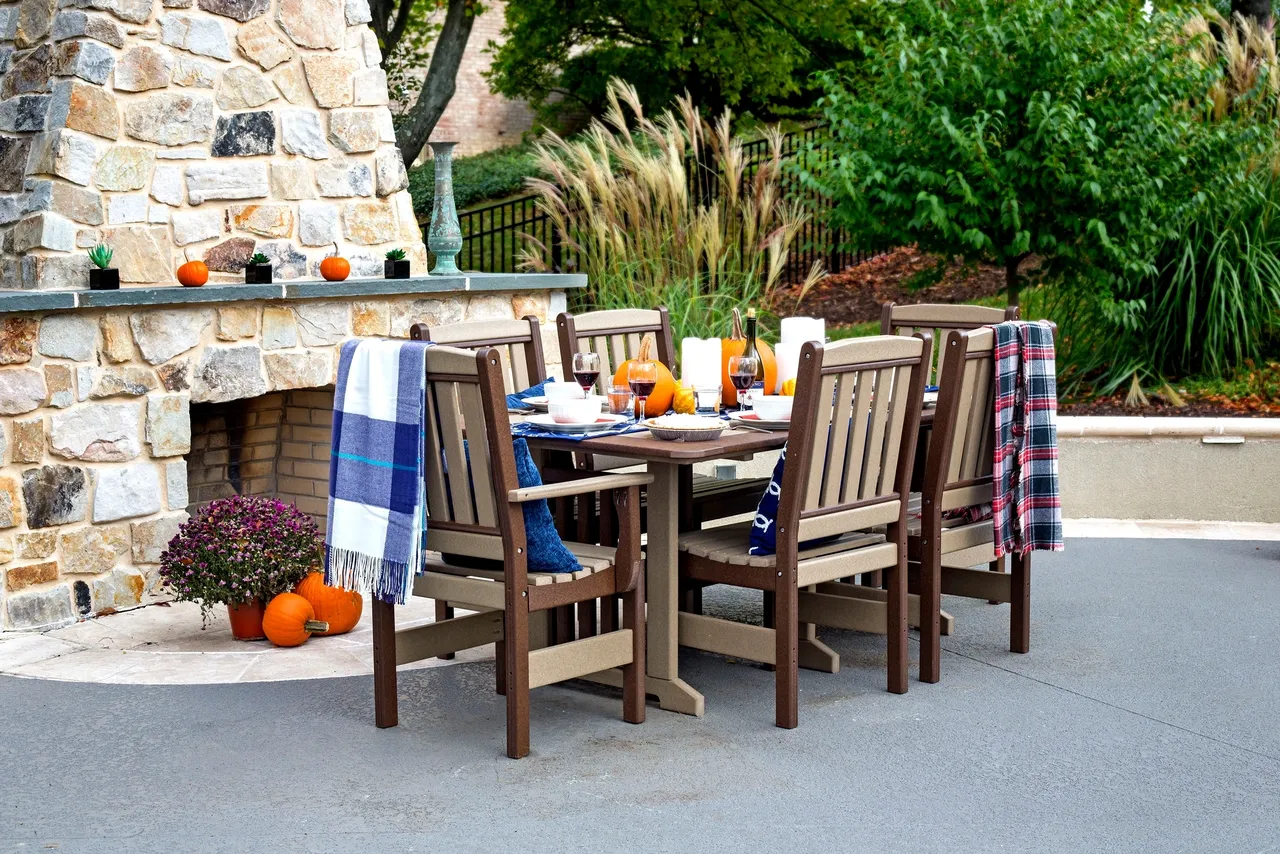 A table and chairs set up outside in the yard.