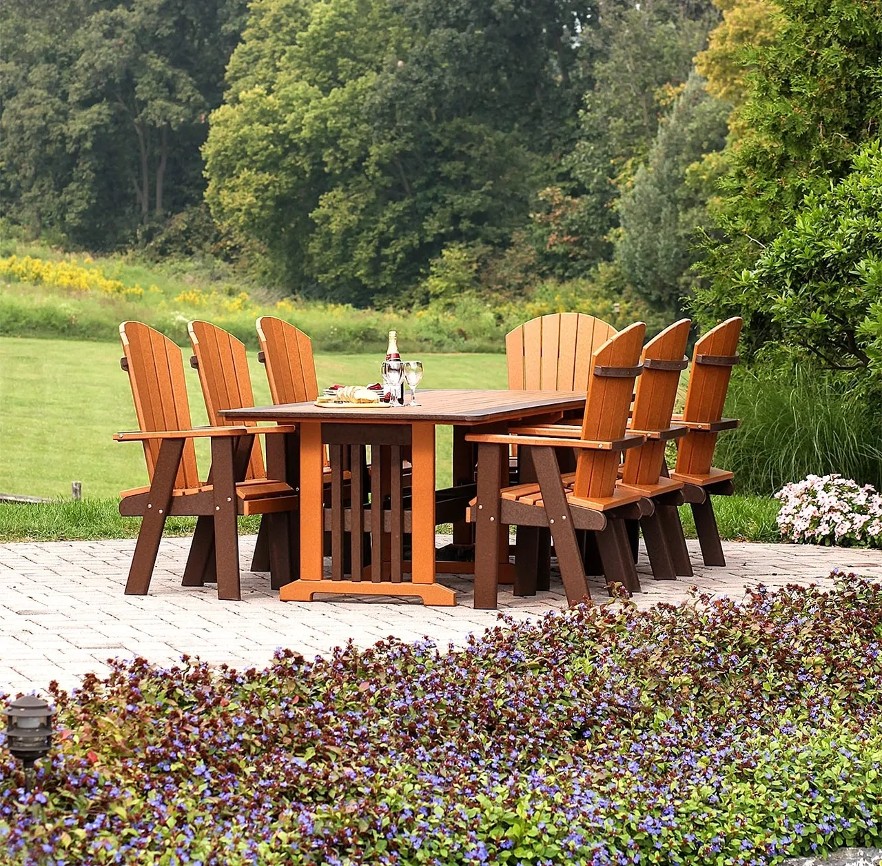 A table and chairs set up in the middle of a garden.