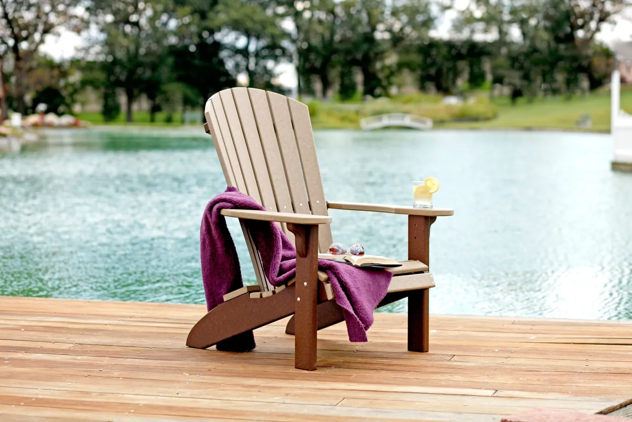 A wooden chair sitting on top of a dock.
