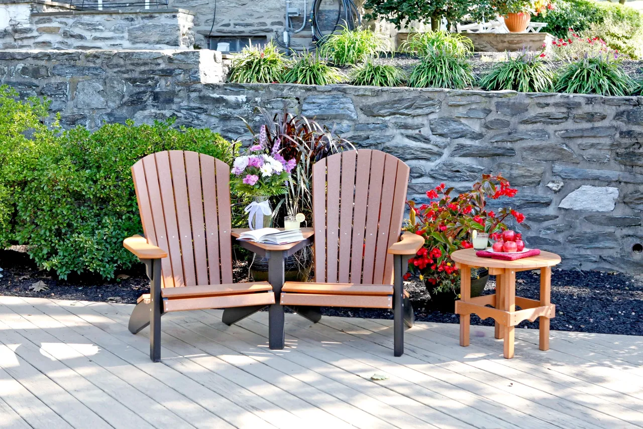 A couple of chairs sitting on top of a brick patio.