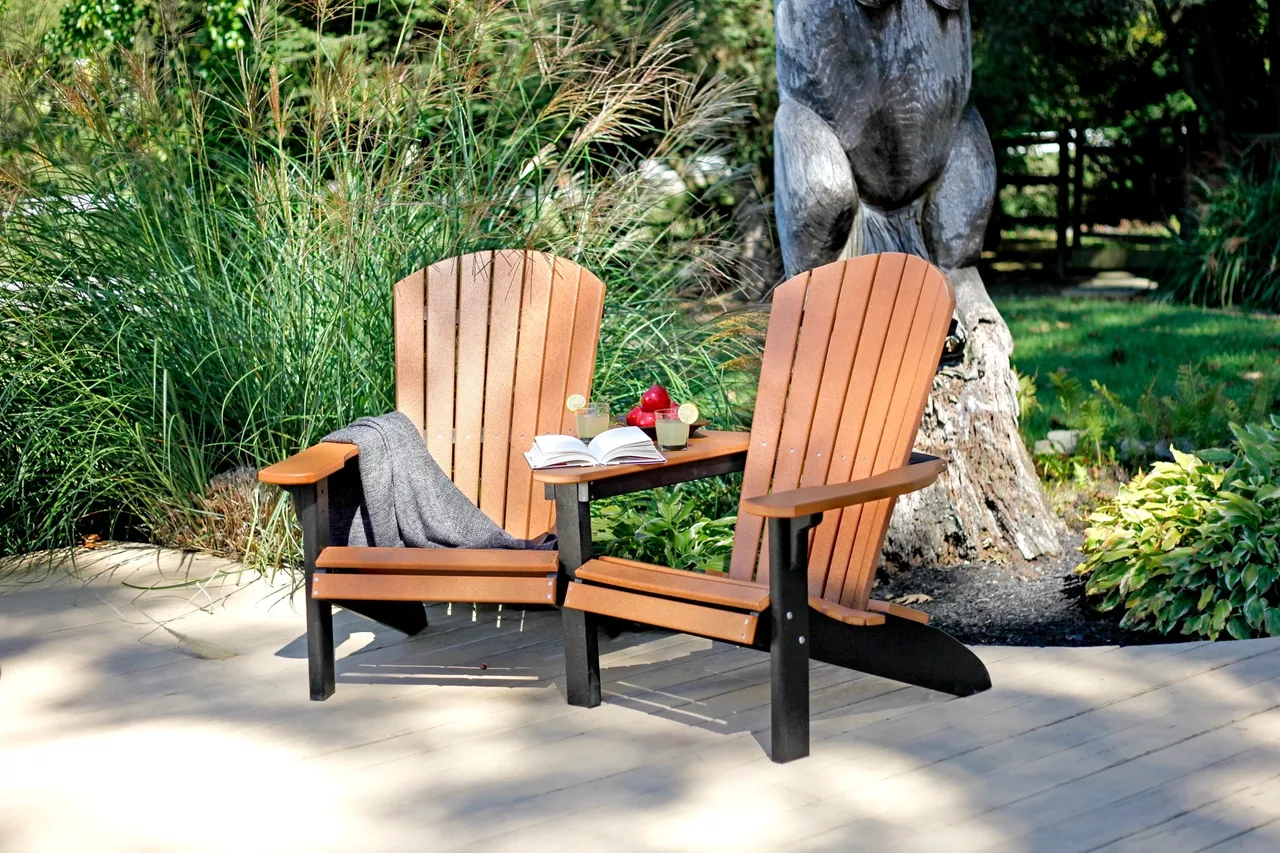 A couple of chairs sitting on top of a cement patio.