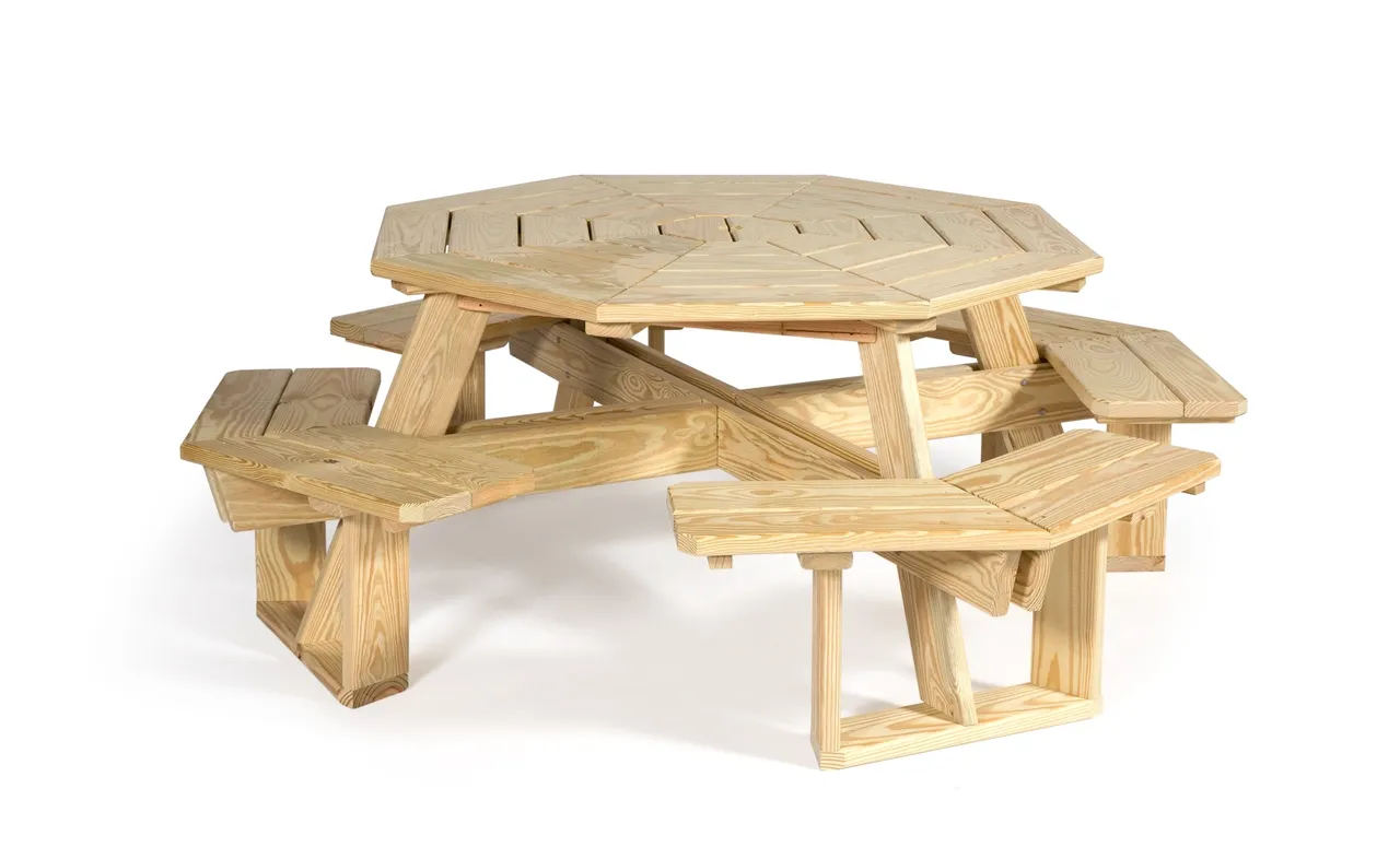 A wooden picnic table with benches on top of it.