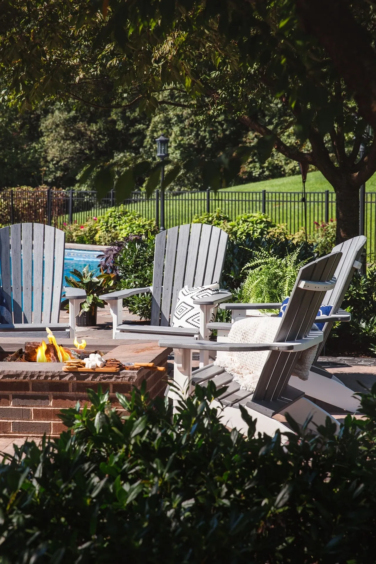 A fire pit with chairs around it