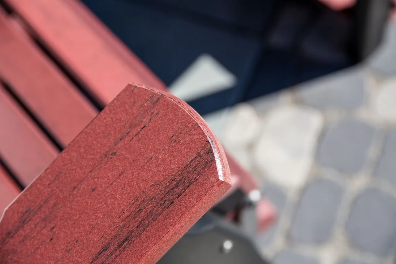 A close up of the corner of a bench