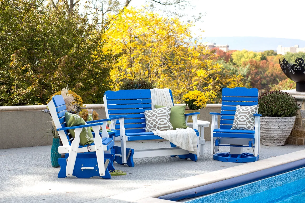 A blue and white patio set by the pool