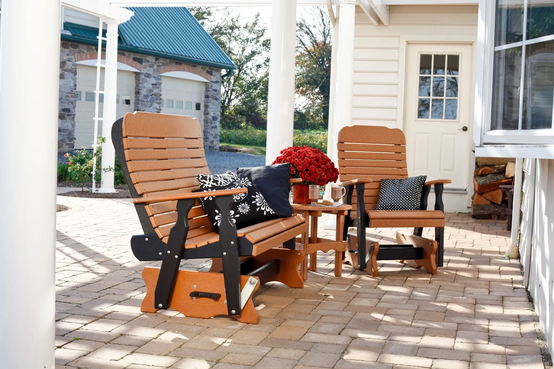 A porch with two chairs and a table.