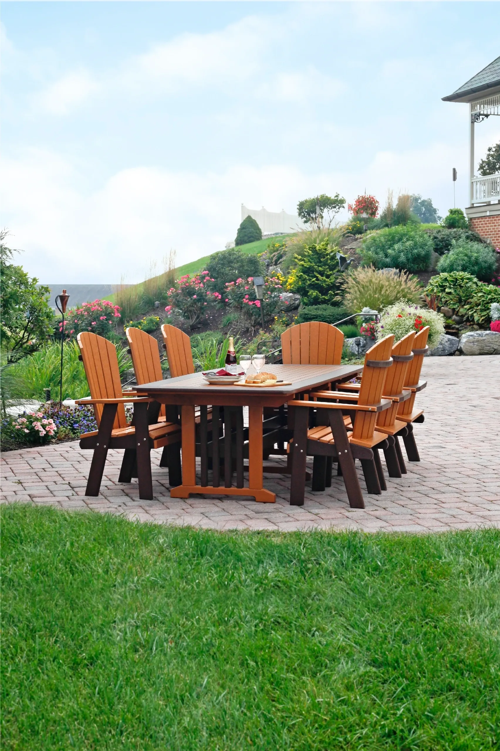 A table and chairs set up in the middle of a garden.